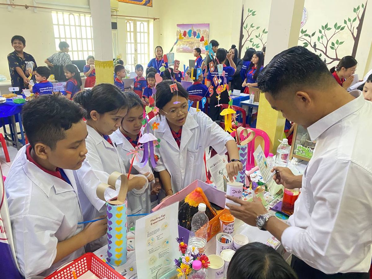 Students presenting a volcano science experiment